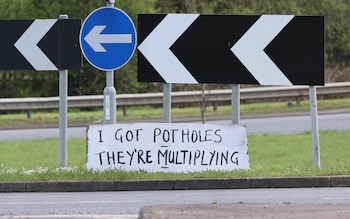 ‘Daventry Banksy’ erects 26 signs to shame council over pothole-ridden roads