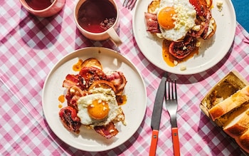 Brioche with bacon, fried egg and chilli-roast tomatoes recipe