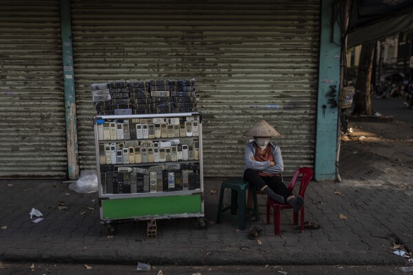 E-waste is overflowing landfills. At one sprawling Vietnam market, workers recycle some of it