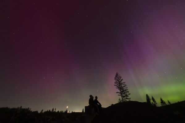 Solar storm puts on brilliant light show across the globe, but no serious problems reported