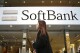 Japan’s SoftBank Group trims investment losses but remains in red for fiscal year