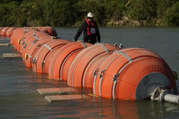 Future of Texas’ migrant-blocking buoys may hinge on whether the Rio Grande is ‘navigable’