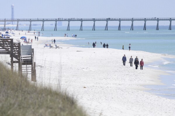 Florida authorities warn of shark dangers along Gulf Coast beaches after 3 people are attacked