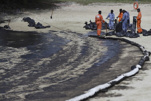 Singapore rushes to clean up oil slick after boat hits stationary fuel supply ship