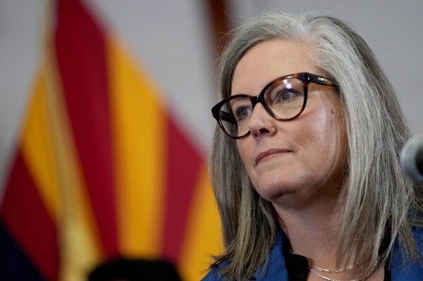 Arizona governor signs budget into law after fierce negotiations to make up a massive shortfall