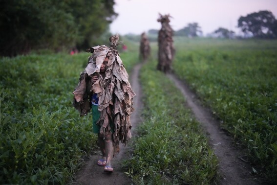 An AP Photographer picked his own path when trying to make the perfect Mud People Festival photo