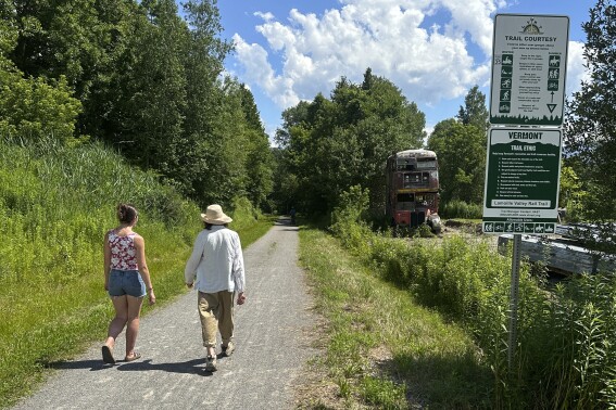 Hikers and cyclists can now cross Vermont on New England’s longest rail trail, a year after floods