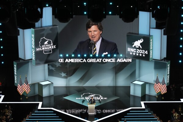 15 months after his firing, Tucker Carlson returns to Fox News airwaves with a GOP convention speech