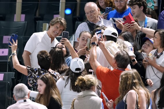 When Biles competes, the show is in the stands too. Tom Cruise, more stars attend her Olympic return