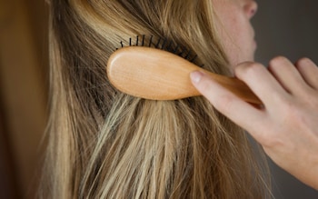 The old hairbrushing ritual of 100 strokes a night is back – here’s how to do it right