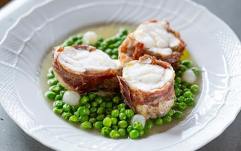 Monkfish wrapped in prosciutto with peas recipe