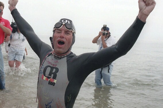 Marathon swimmer ends his quest to cross Lake Michigan after two days