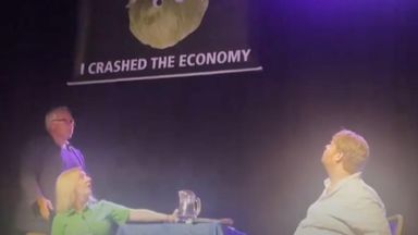 Liz Truss storms off stage after lettuce banner prank