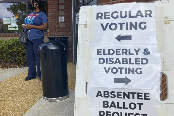 Big Georgia county to start charging some costs to people who challenge the eligibility of voters