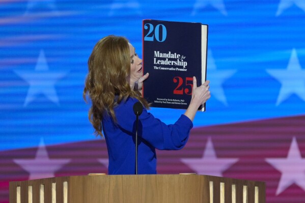 Throwing the book: Democrats enlarge a copy of the ‘Project 2025' blueprint as an anti-GOP prop