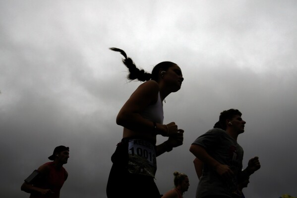 Runners are used to toughing it out. A warming climate can make that deadly