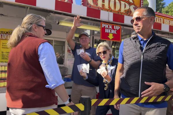 It’s a pork chop on a stick and a vanilla shake for Tim Walz at the Minnesota State Fair