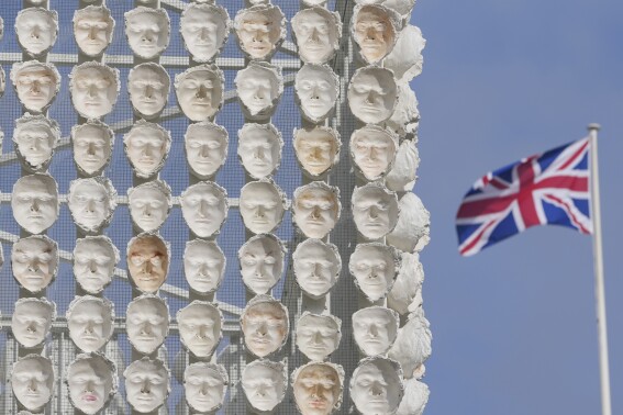 Faces of transgender people adorn an artwork in London’s Trafalgar Square