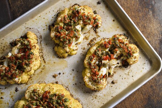 Nutty Parmesan, briny capers and pickled peppers turn cauliflower steaks into a satisfying main