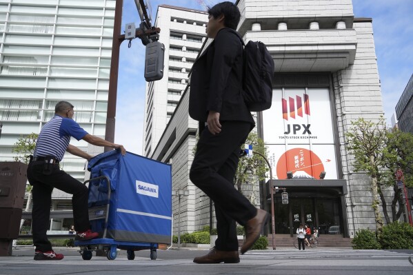 Markets in Europe and Asia are mixed, as Japan’s benchmark rebounds from Monday’s big tumble