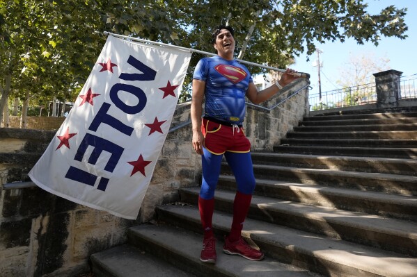 AP PHOTOS: An artist summons Superman to remind people the power of voting