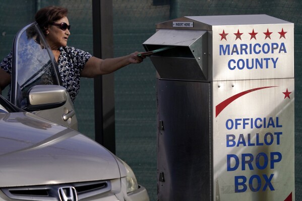 Arizona enlists county employees to help tackle a surge of 2-page early ballots