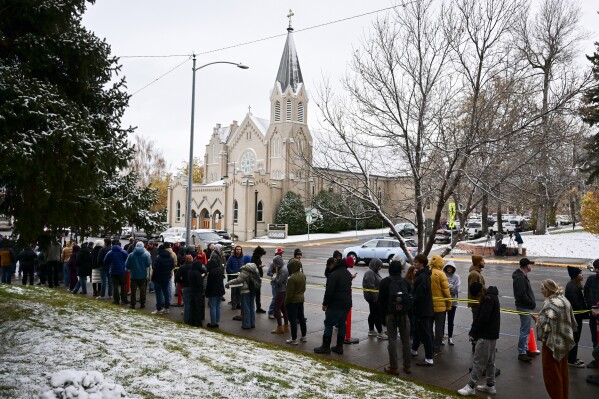 Free pizza and a DJ help defrost Montana voters lined up until 4 a.m. in the snow to vote